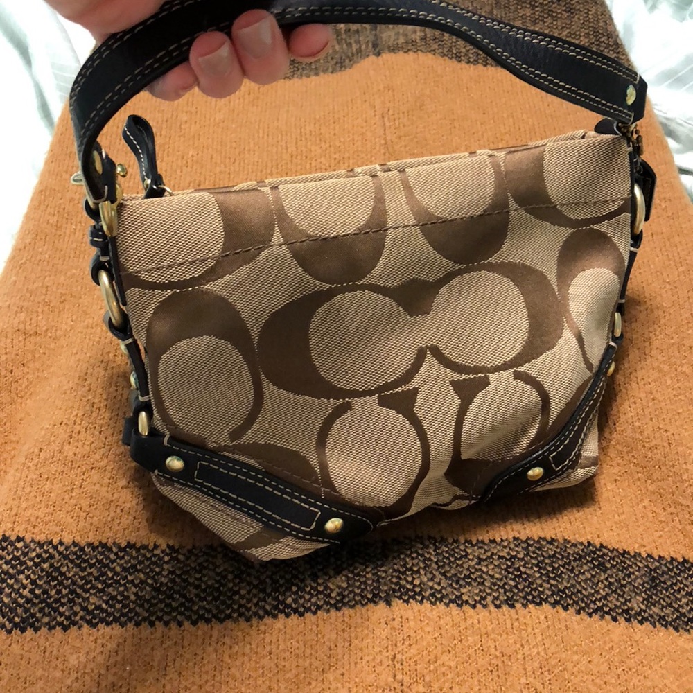 Authentic Coach bag that is a great accessory!